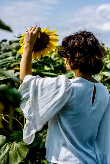 Sunflower and Woman in Garden